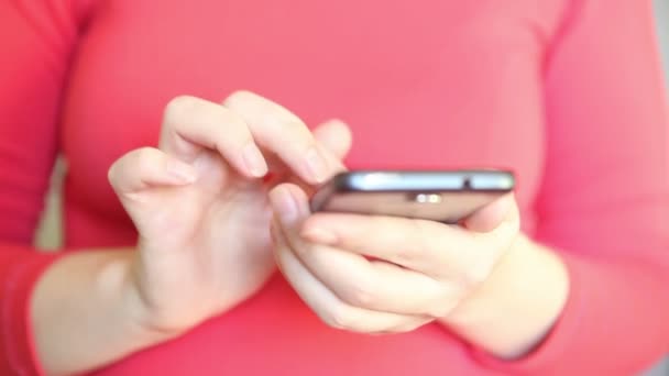 Woman writes a message smartphone, close up — Stock Video