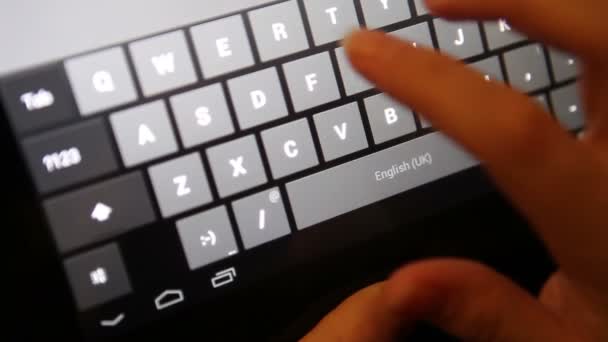 Fingers typing on the tablet; close-up — Stock Video