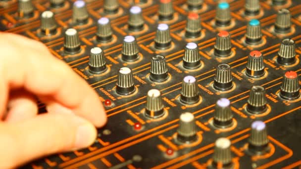 It adjusts the sound mixer, close-up — Stock Video