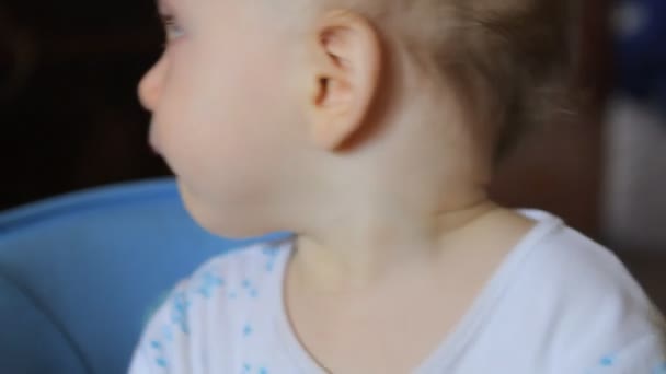 Portrait of baby with blue pacifier — Stock Video