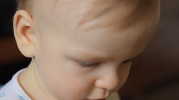 Portrait of baby with blue pacifier — Stock Video