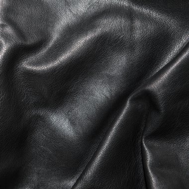 Siyah deri kıvrımları arka planda