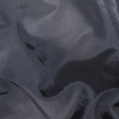 Siyah kumaş. Arka planda kıvrımları.