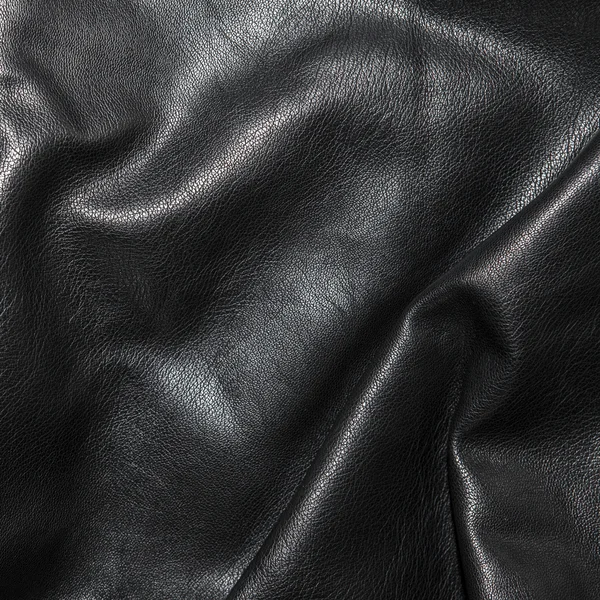 Siyah deri kıvrımları arka planda