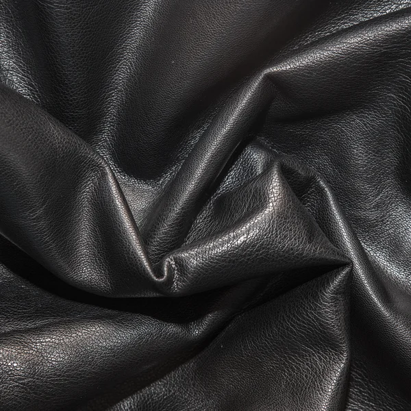 Fond en cuir noir dans les plis — Photo