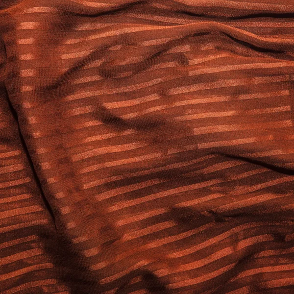 Tessuto marrone a righe. Sfondo nelle pieghe . — Foto Stock