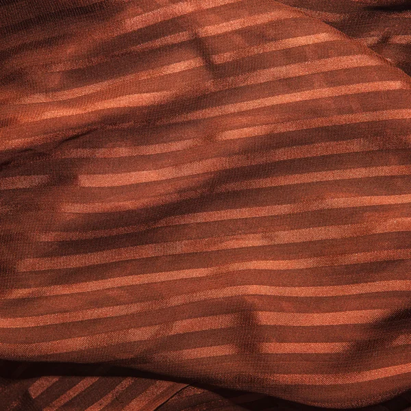 Tissu rayé marron. Contexte dans les plis . — Photo