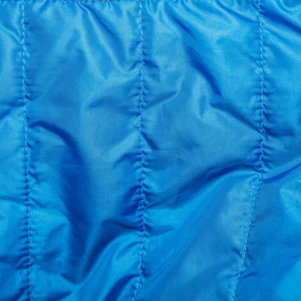 Tissu bleu. Contexte dans les plis . — Photo