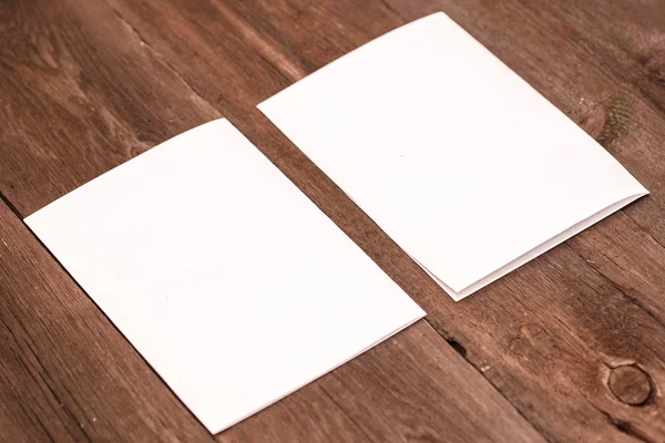 Sheet of paper on a wooden background — Stock Photo, Image
