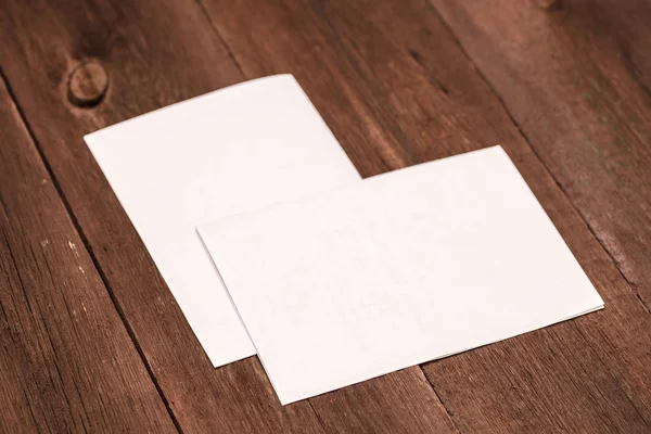 Sheet of paper on a wooden background — Stock Photo, Image
