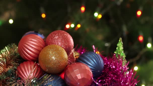 Christmas balls and fir tree with garland flashing. Background — Stock Video