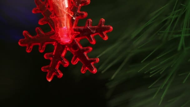 Flashing light garlands in the form snowflakes. — Stock Video