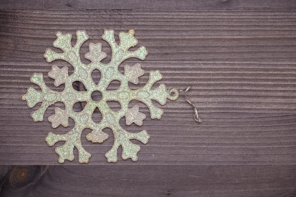 Snowflake Christmas decorations on wooden background — Stock Photo, Image