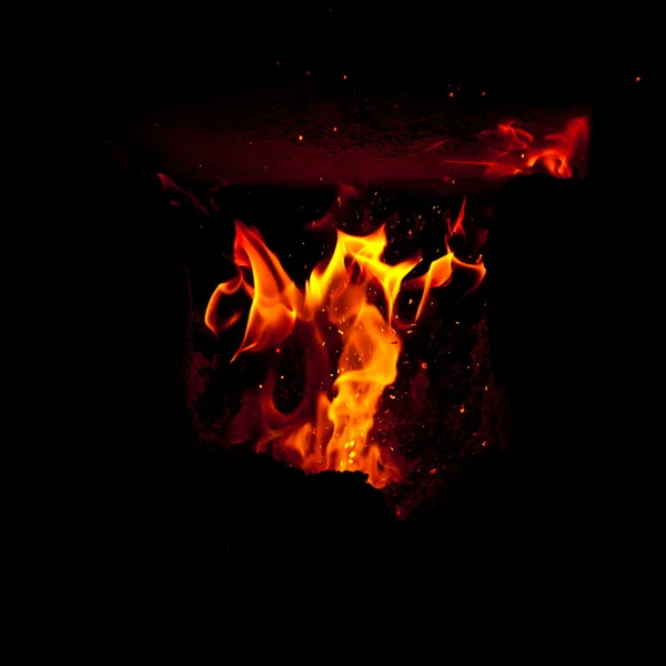 Flames erupt from the combustion chamber of the furnace — Stock Photo, Image