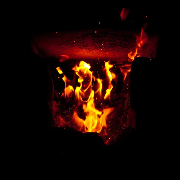 Flames erupt from the combustion chamber of the furnace — Stock Photo, Image