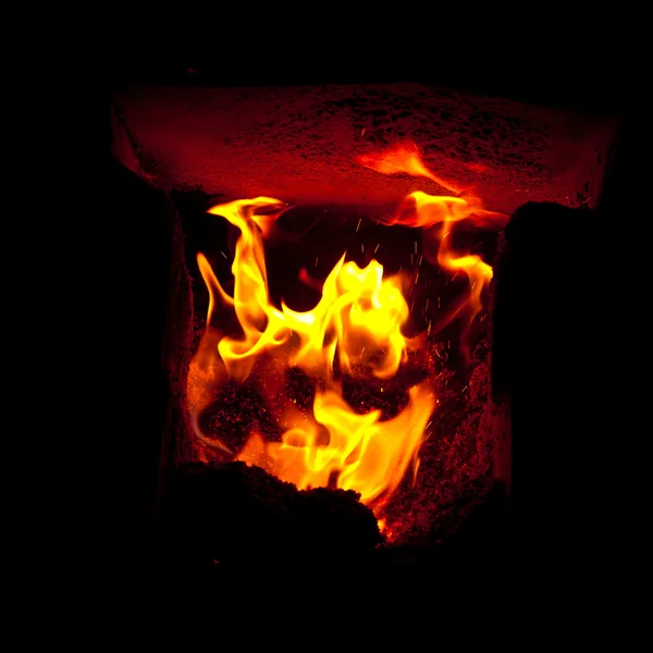 Flames erupt from the combustion chamber of the furnace — Stock Photo, Image