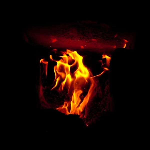 Flames erupt from the combustion chamber of the furnace — Stock Photo, Image