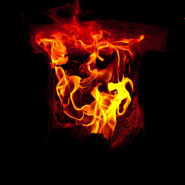 Flames erupt from the combustion chamber of the furnace — Stock Photo, Image