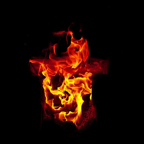 Flames erupt from the combustion chamber of the furnace, on a black background — Stock Photo, Image