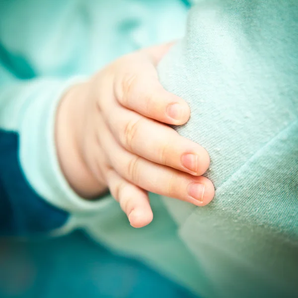 Baby hand closeup, shallow depth of field — Stock Photo, Image