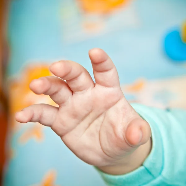 Baby hand closeup, shallow depth of field — Stock Photo, Image