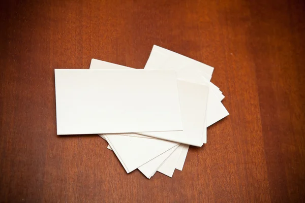 Blank business card on a wooden background — Stock Photo, Image