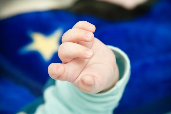 Baby hand closeup, shallow depth of field — Stock Photo, Image