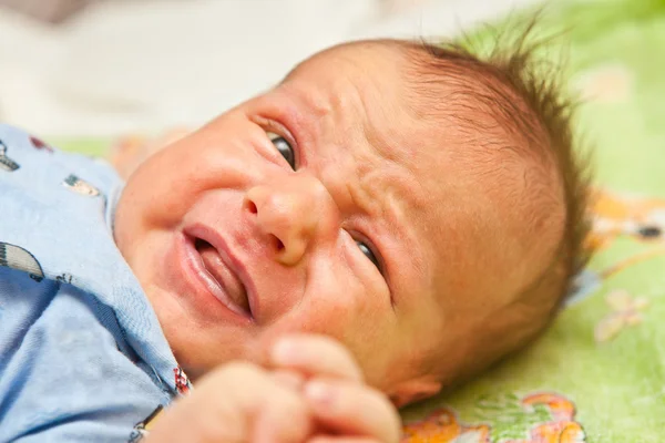 Portrait of a newborn baby crying, shallow depth of field — Stock Photo, Image