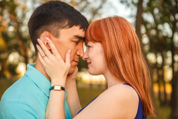 stock image Young couple hugging in forest outdoors