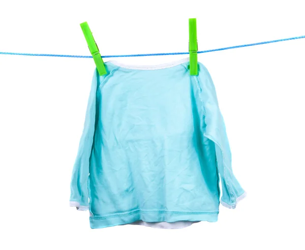 Turquoise blouse is dried on the clothesline on a white backgrou — Stock Photo, Image