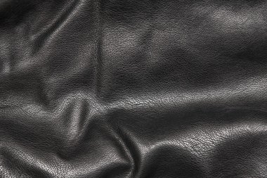 Siyah deri kıvrımları arka planda