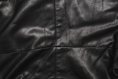 Siyah deri kıvrımları arka planda
