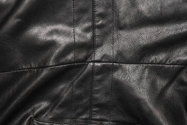Siyah deri kıvrımları arka planda