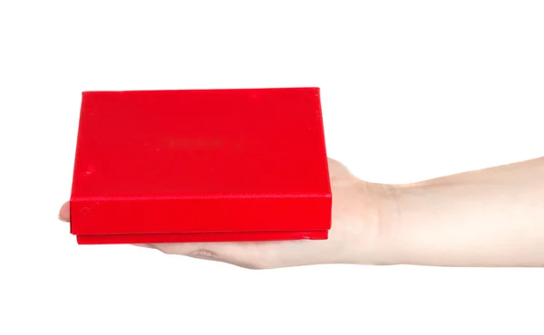 Red box in a female hand on a white background — Stock Photo, Image