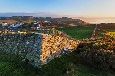 Stone Wall and Coastal View near Mortehoe in North Devon, Englan clipart
