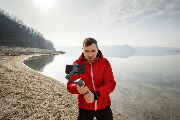 Giovane Scatta Video Telefono Uno Stabilizzatore Elettronico Foto Stock