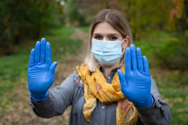 Portrait Caucasian Woman Mask Gloves Showing Stop Sign Park Autumn — Stock Photo, Image