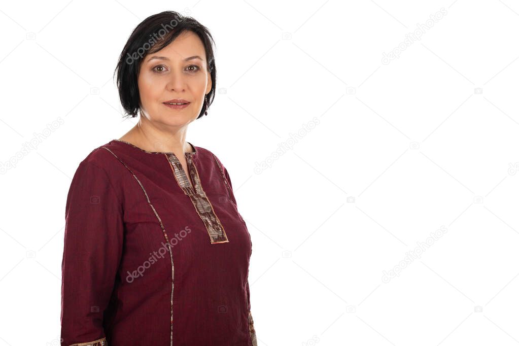 Portrait of cheerful lady in her 50s smiling to the camera on isolated background