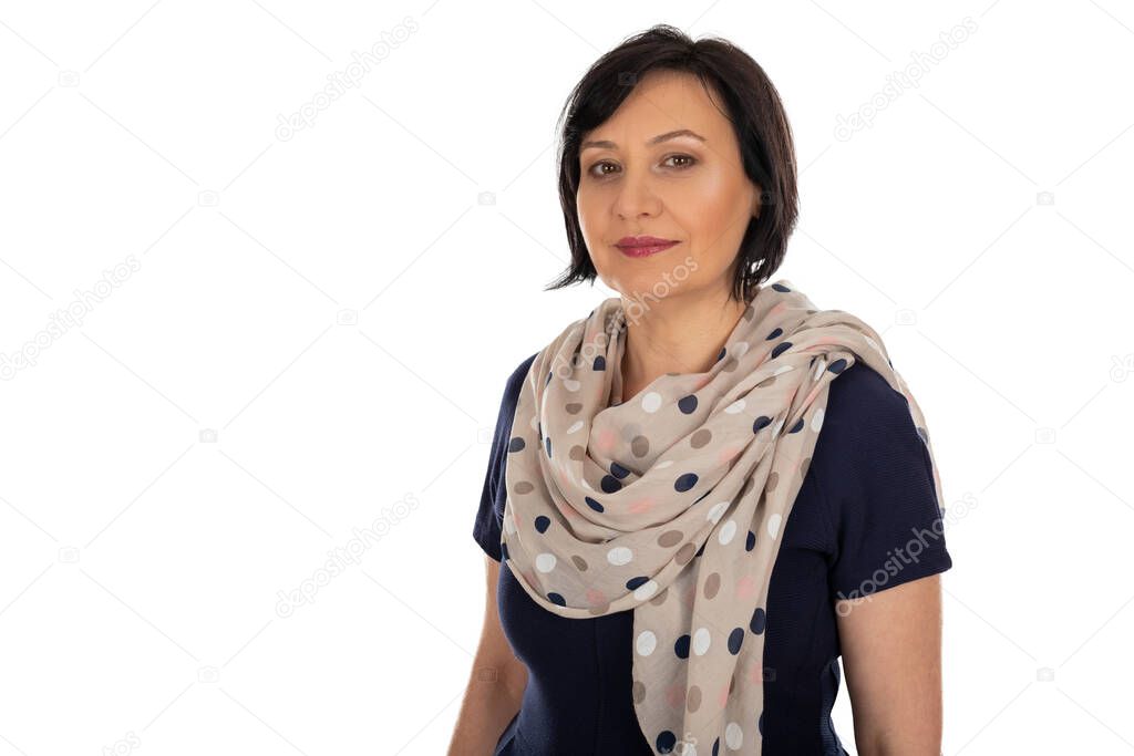 Portrait of charming middle aged woman with elegant scarf on isolated background