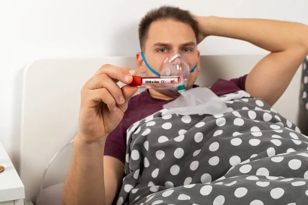 Young Caucasian Man Covid Symptoms Lying Bed Home Holding Blood — Stock Photo, Image