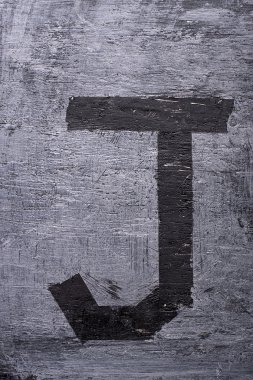 Black grunge alphabet. Letter J