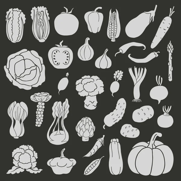 Iconos de verduras sobre fondo negro — Vector de stock