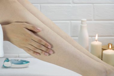 Skin care, body. Preparing legs for the procedure of hair removal. Hair on the legs of women. Body positive, self-acceptance, feminism. Apply the cream, massage. Strawberry legs, keratosis. Relaxation clipart