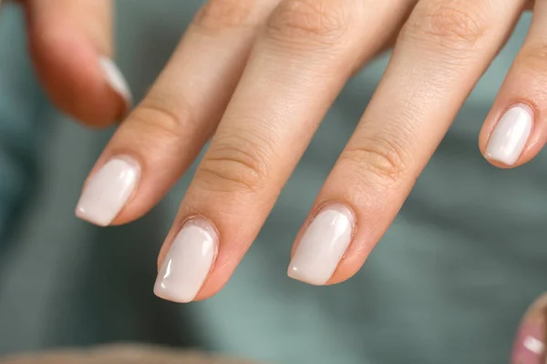 Manicure. Nude nail polish, classic. Overgrown nail polish. Manicure correction. An old manicure. Nail care. Beauty salon, SPA, procedure. Home nail care. Manicure tools. Beauty, lifestyle.