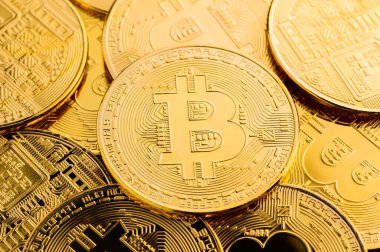 Pile of gold bitcoins background