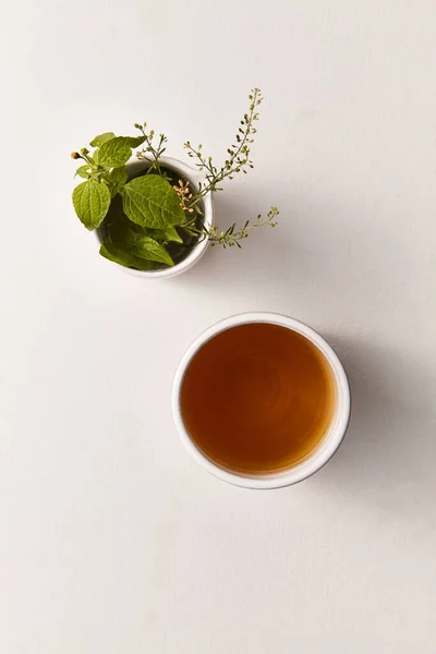 Herbal tea top view on a light background — Stock Photo, Image