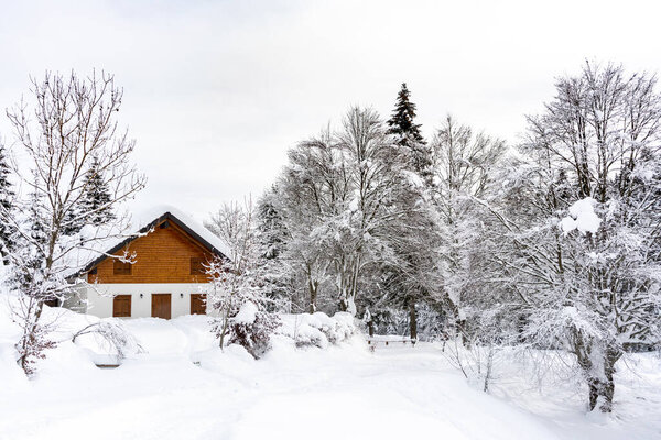 Cottage in a snowy landscape in Altopiano di Asiago