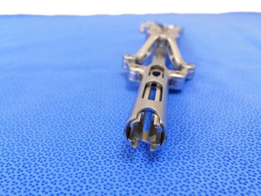 Closeup Image Of Spinal Surgical Instrument Beale Rod Reducer Short. Selective Focus clipart