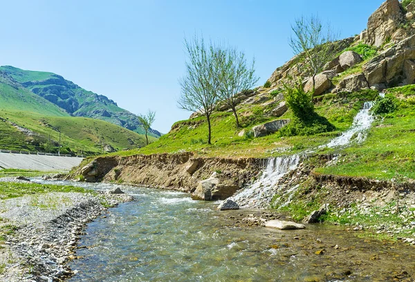 The stream meets the river — Stock Photo, Image