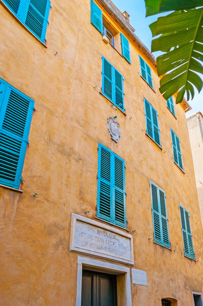 AJACCIO, FRANCE - MAY 2, 2013: The Maison Bonaparte is the Napoleon's birth house with the small stone sign board above the entrance, located in St Charles street, on May 2 in Ajaccio.